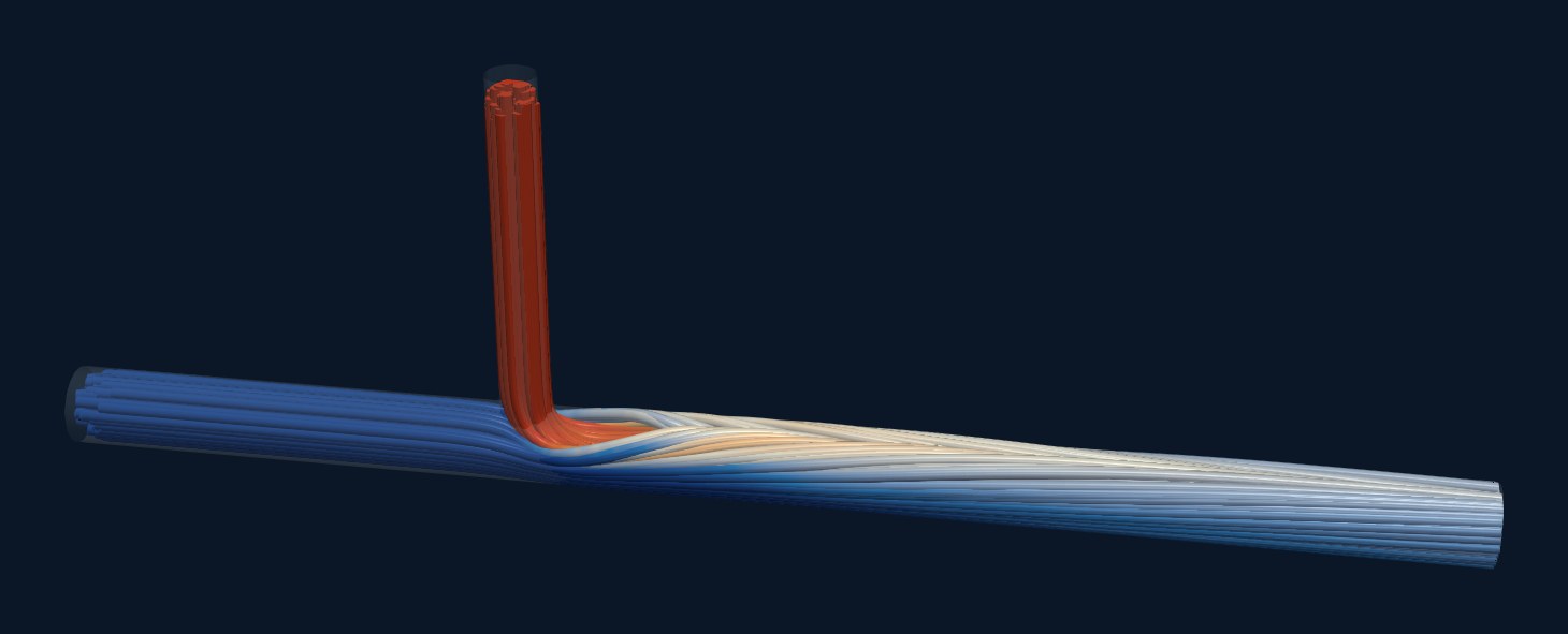 Streamlines through the mixing tee, coloured by temperature: the hot jet from the branch bends over with the cold stream and rides on top of it as a warm layer.